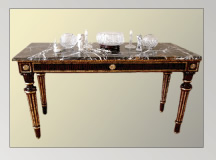 Mahogany table trimmed with gold leaf